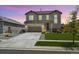 Beautiful two-story home featuring a well-manicured lawn, a two car garage, and lovely landscaping at 16268 Mount Silverheels Way, Broomfield, CO 80023