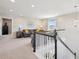 Bright living room features neutral tones, plush carpeting, and a cozy seating area near the window at 16268 Mount Silverheels Way, Broomfield, CO 80023