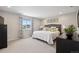 Serene main bedroom featuring neutral tones, soft carpet, and a window providing natural light at 16268 Mount Silverheels Way, Broomfield, CO 80023