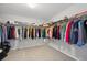 Spacious walk-in closet with ample hanging space and shelving for optimal organization at 16268 Mount Silverheels Way, Broomfield, CO 80023