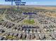 Stunning aerial view of a community with nearby golf course, shopping, and park at 24447 E Ada Ave, Aurora, CO 80018