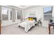 Bright bedroom with large windows and tray ceiling, creating a peaceful retreat at 24447 E Ada Ave, Aurora, CO 80018