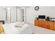 Bedroom with an office nook, light colored carpet, and neutral walls at 24447 E Ada Ave, Aurora, CO 80018