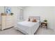 Bright bedroom with a plush bed, a dresser, neutral accents, and a large window with blinds for natural light at 24447 E Ada Ave, Aurora, CO 80018