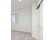 Bright bedroom featuring a window, plush carpet, and a closet with sliding doors at 24447 E Ada Ave, Aurora, CO 80018