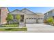 Single-Gathering home with a well-maintained lawn and an attached three-car garage at 24447 E Ada Ave, Aurora, CO 80018