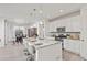 Modern kitchen with a large granite island, pendant lighting and stainless steel appliances at 24447 E Ada Ave, Aurora, CO 80018