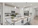 Bright kitchen with granite countertops, stainless steel appliances, and barstool seating at 24447 E Ada Ave, Aurora, CO 80018