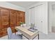 A nicely decorated and cozy office space featuring a desk, chair and decorative wood paneling at 24447 E Ada Ave, Aurora, CO 80018