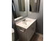 The bathroom features a white sink and vanity with chrome fixtures and gray walls at 14493 E Jewell Ave # 102, Aurora, CO 80012