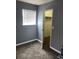 Cozy bedroom with neutral carpet, a bright window, and a walk-in closet at 14493 E Jewell Ave # 102, Aurora, CO 80012
