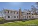 Traditional-style condo building with exterior balconies and a well-maintained lawn at 14493 E Jewell Ave # 102, Aurora, CO 80012