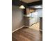 Bright kitchen and dining area with wood cabinets and white appliances at 14493 E Jewell Ave # 102, Aurora, CO 80012