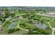 Community aerial view showcasing a park, tennis court, pond, and green spaces for an active lifestyle at 4025 Trail Stone Cir, Castle Rock, CO 80108