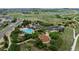 Aerial view of community pool, clubhouse, playground, and green spaces, creating inviting outdoor amenities at 4025 Trail Stone Cir, Castle Rock, CO 80108