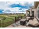 Outdoor patio with comfortable seating, a fire pit table, and views of the surrounding community at 4025 Trail Stone Cir, Castle Rock, CO 80108