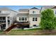 Expansive back exterior featuring a spacious deck, stairs, and beautiful views at 4025 Trail Stone Cir, Castle Rock, CO 80108