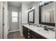 Elegant bathroom with double vanity, modern fixtures, and stylish mirrors, offering a spa-like experience at 4025 Trail Stone Cir, Castle Rock, CO 80108