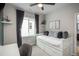 Bright bedroom with a stylish daybed, floating shelves, and serene decor to create a cozy space at 4025 Trail Stone Cir, Castle Rock, CO 80108
