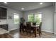 Cozy dining area with wood table and chairs, bathed in natural light from nearby windows at 4025 Trail Stone Cir, Castle Rock, CO 80108
