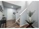 Inviting entryway with decorative table and plant, leading to the stairs and upper levels of the home at 4025 Trail Stone Cir, Castle Rock, CO 80108