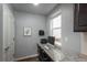 Bright home office features granite countertop, desk and decor, with a window offering natural light at 4025 Trail Stone Cir, Castle Rock, CO 80108