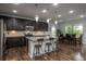 Elegant kitchen featuring granite countertops, stainless steel appliances, and island seating at 4025 Trail Stone Cir, Castle Rock, CO 80108