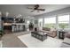 Spacious living area with a fireplace, and a modern open-concept kitchen at 4025 Trail Stone Cir, Castle Rock, CO 80108