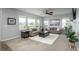 Bright living room with large windows, plush sofas, and elegant decor at 4025 Trail Stone Cir, Castle Rock, CO 80108