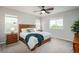 Comfortable main bedroom with natural light, ceiling fan, and neutral decor, creating a relaxing space at 4025 Trail Stone Cir, Castle Rock, CO 80108