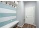 Functional mudroom with storage hooks and bench, seamlessly connected to the entrance at 4025 Trail Stone Cir, Castle Rock, CO 80108