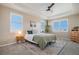 Spacious main bedroom with neutral decor, plantation shutters, and ceiling fan at 2640 Cache Creek Ct, Castle Rock, CO 80108