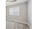 Cozy bedroom with soft carpeting, a large window, and a neutral color scheme at 765 Freestone St, Brighton, CO 80603