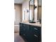 Elegant bathroom with double vanity, sleek black fixtures, and modern design at 16132 W 14Th Ave, Golden, CO 80401