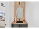 Chic powder room featuring a unique mirror, modern sink, and stylish fixtures for a sophisticated touch at 16132 W 14Th Ave, Golden, CO 80401