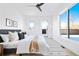 Bright bedroom with large windows offering mountain views and a comfortable bed at 16132 W 14Th Ave, Golden, CO 80401