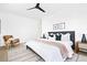 Bedroom featuring a comfortable bed with plush bedding and stylish decor at 16132 W 14Th Ave, Golden, CO 80401