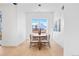 Elegant dining room featuring a modern chandelier and a large window with scenic outdoor views at 16132 W 14Th Ave, Golden, CO 80401