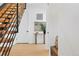 Bright entryway with floating stairs, light wood floors, and stylish decor at 16132 W 14Th Ave, Golden, CO 80401