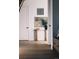 Modern hallway with hardwood floors, stylish console table, and contemporary artwork at 16132 W 14Th Ave, Golden, CO 80401