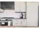 Well-appointed kitchen with modern appliances, stylish cabinetry, and sleek countertops, creating a functional space at 16132 W 14Th Ave, Golden, CO 80401