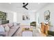 Open-concept living room with modern decor, hardwood floors, and comfortable seating at 16132 W 14Th Ave, Golden, CO 80401
