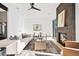Contemporary living room featuring stylish seating, a brick fireplace, and ample natural light creating a cozy ambiance at 16132 W 14Th Ave, Golden, CO 80401