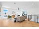 Spacious living room with hardwood floors, modern furniture, and plenty of natural light at 16132 W 14Th Ave, Golden, CO 80401