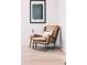 Cozy reading nook with a comfortable armchair, wooden side table, and natural light at 16132 W 14Th Ave, Golden, CO 80401