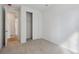 An open bedroom features a closet, carpet, and bright white walls at 1306 Sienna Peak Cir, Erie, CO 80516