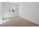 Cozy carpeted bedroom has a window with neighborhood view at 1306 Sienna Peak Cir, Erie, CO 80516