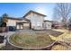 Beautiful backyard with manicured lawn, patio seating, and mature landscaping, ideal for outdoor entertaining and relaxation at 4405 Fairway Ln, Broomfield, CO 80023