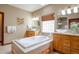 Large bathroom features a jacuzzi tub, dual sinks, and tiled floors and walls at 4405 Fairway Ln, Broomfield, CO 80023