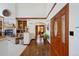 Spacious foyer featuring hardwood floors, a decorative wooden door, and elegant finishes at 4405 Fairway Ln, Broomfield, CO 80023